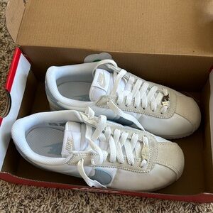 White and blue Nike Cortez